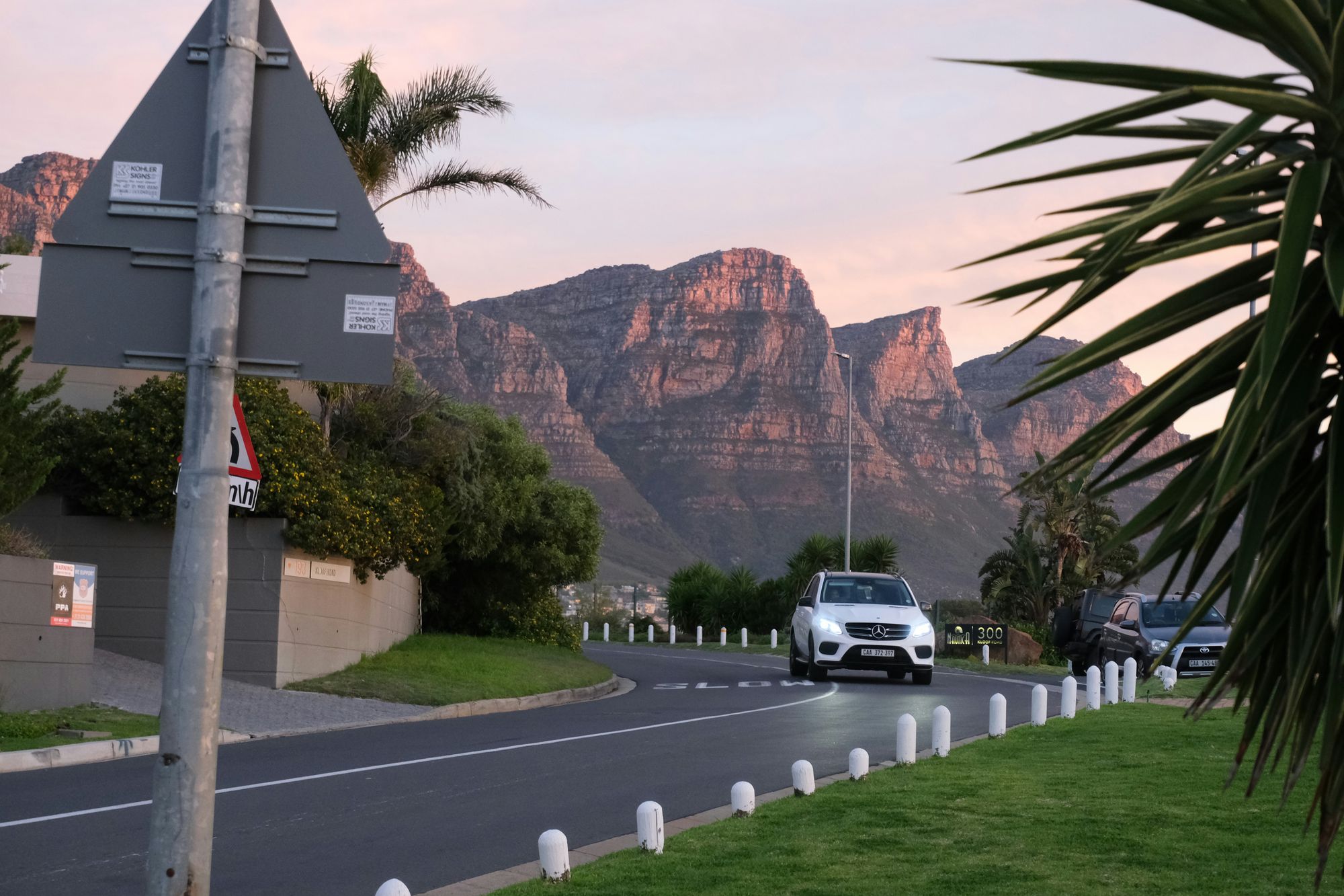 A Mercedes SUV on a coastal road in Cape Town, one of SA Motor Lease's five service areas